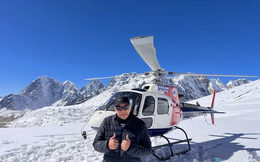 A helicopter landed on the snow near Everest Base Camp
