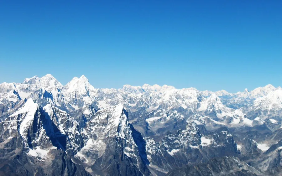 A mountain flight aircraft over the snow peaks of the Himalaya