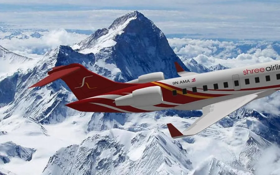 A scenic flight aircraft above the snow peaks